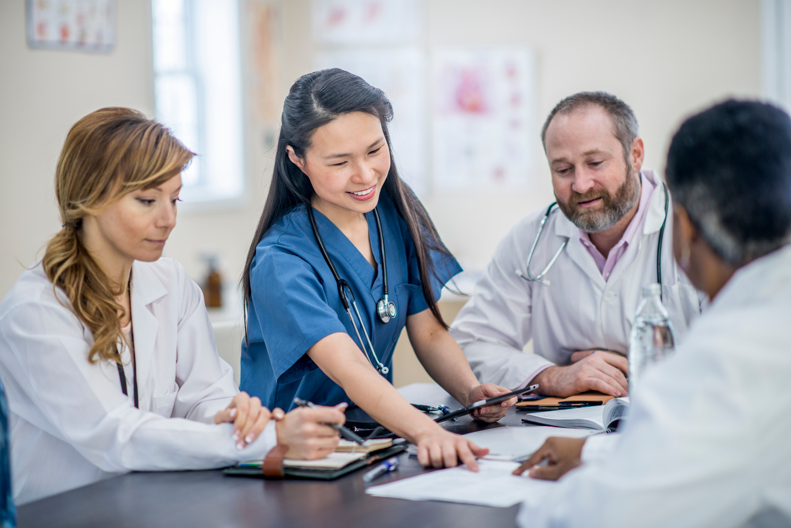 A photo of a group of researchers discussing work