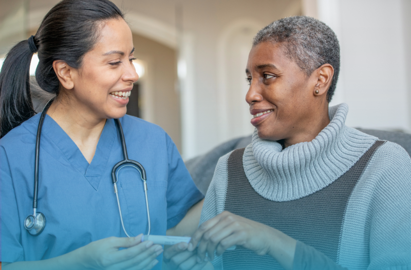 A healthcare professional helping a patient. 