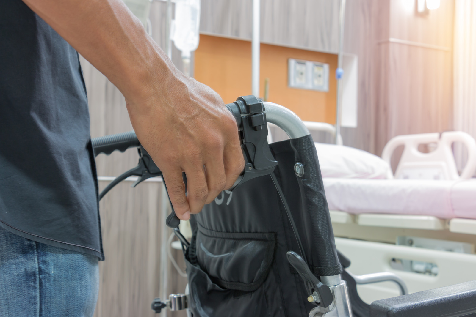Man Holding Wheelchair