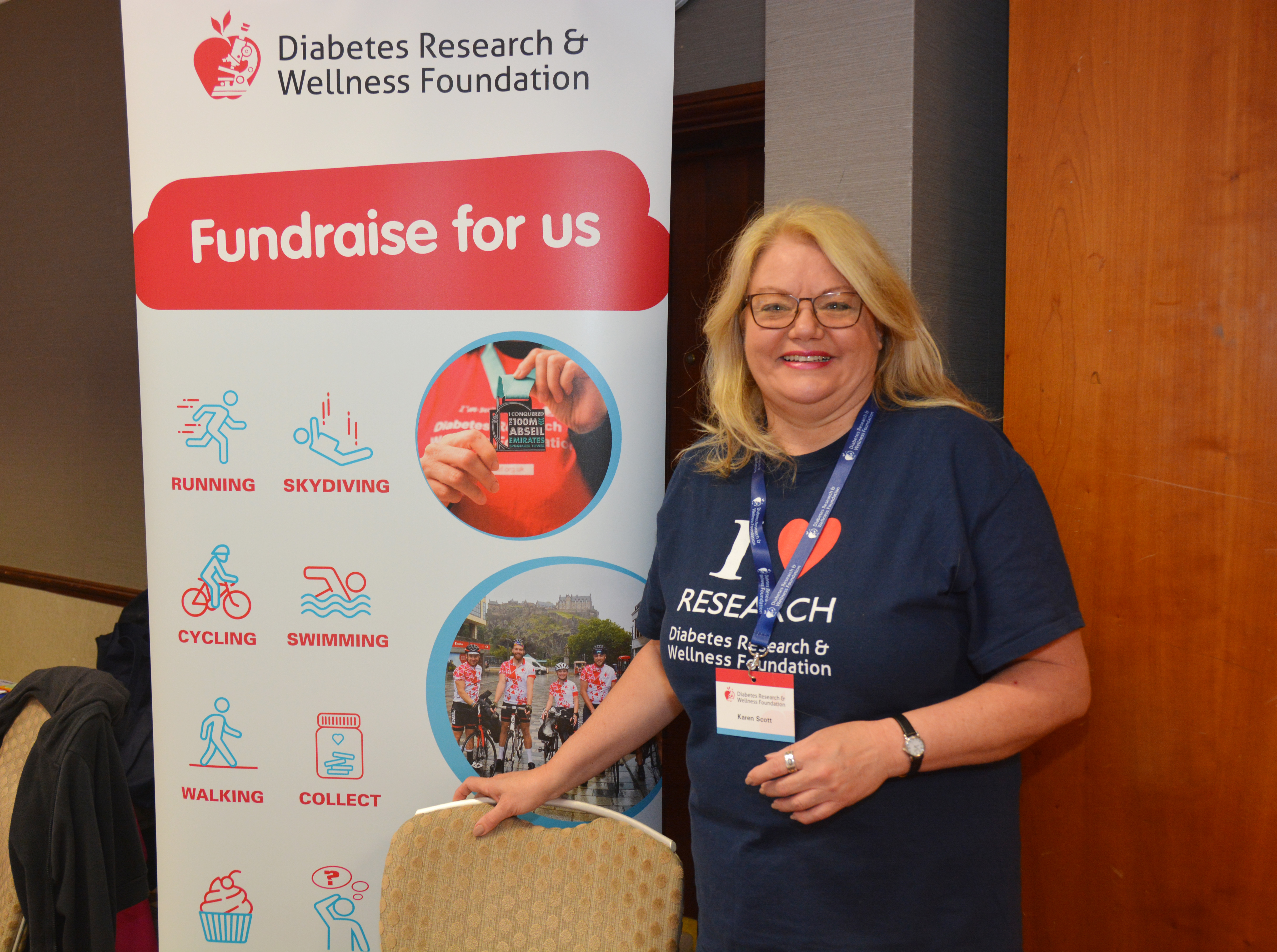 Karen in front of signpost.