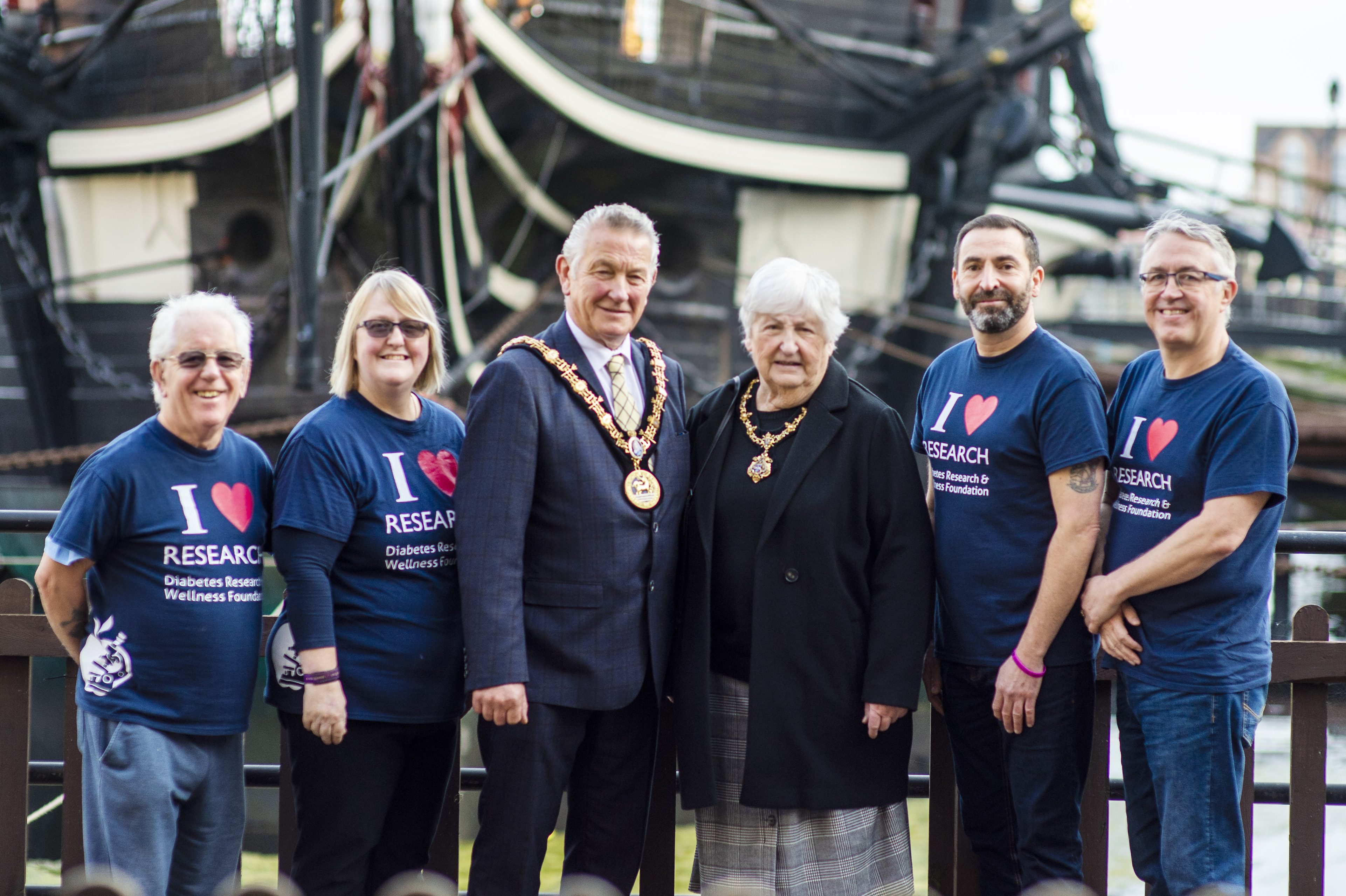 Lee and the Mayor in front of a ship